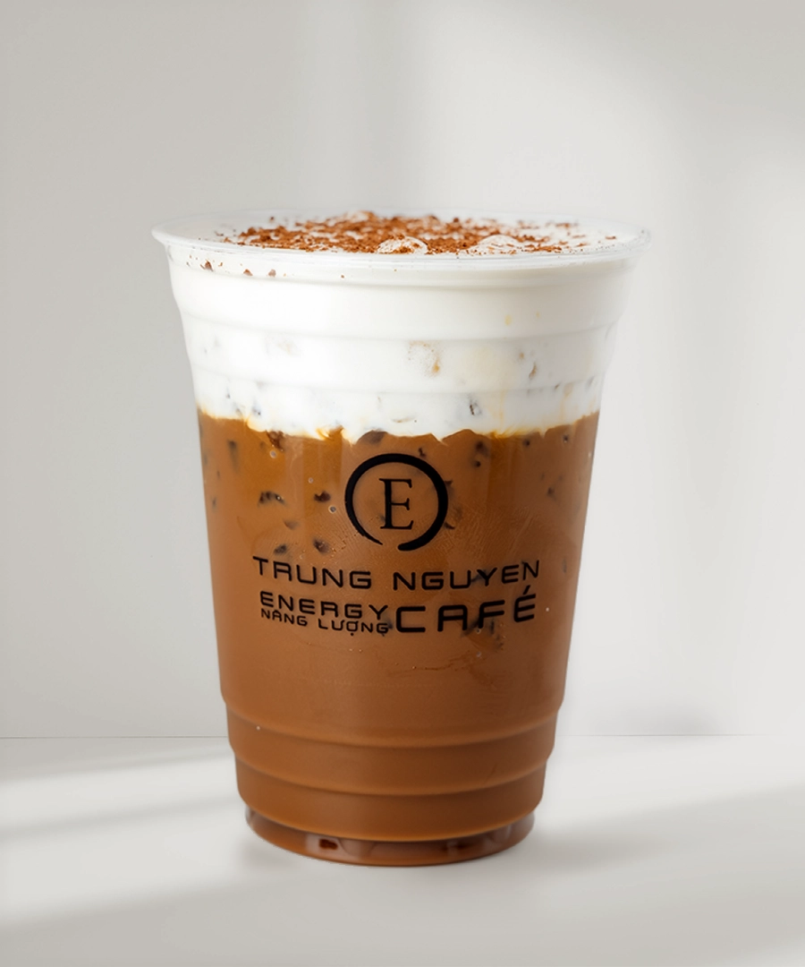 Trung Nguyên E-Coffee signature specialty drink featuring layered foam and coffee, presented in a clear