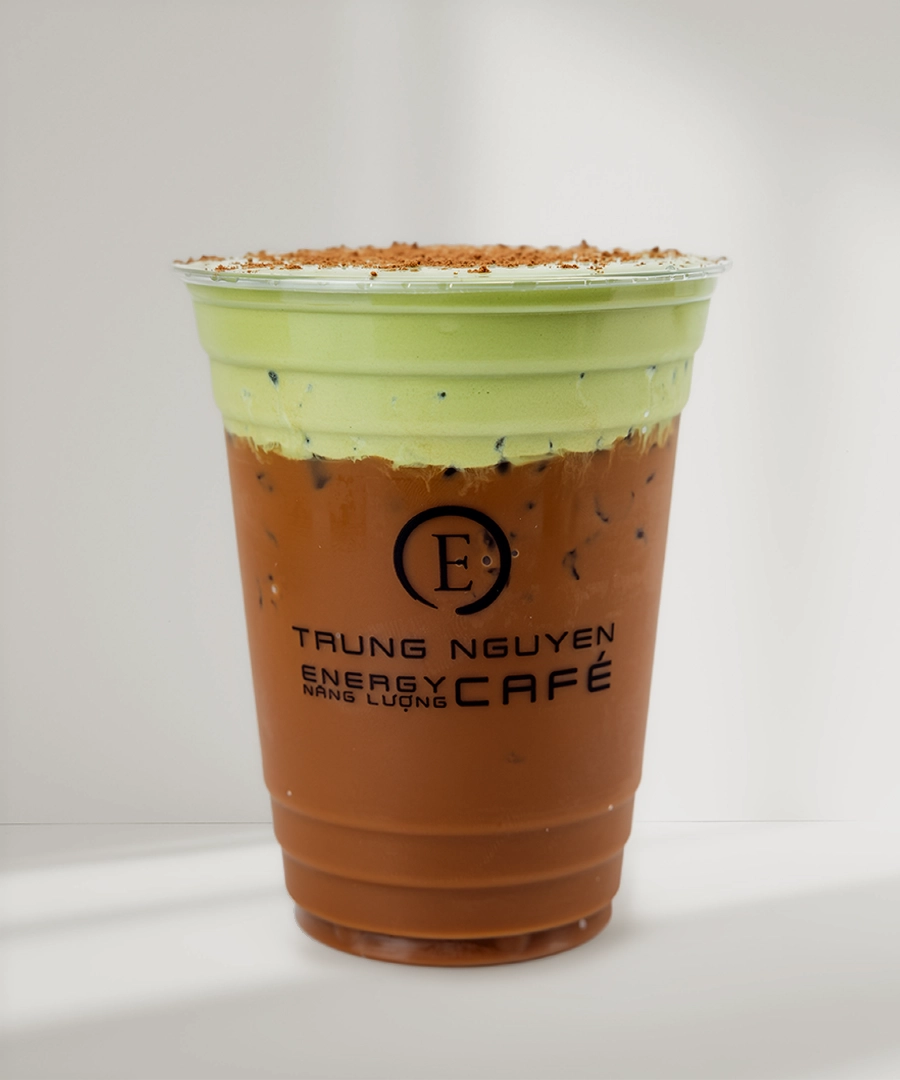 Trung Nguyên E-Coffee signature drink, a vibrant green matcha latte with coffee foam, displayed
