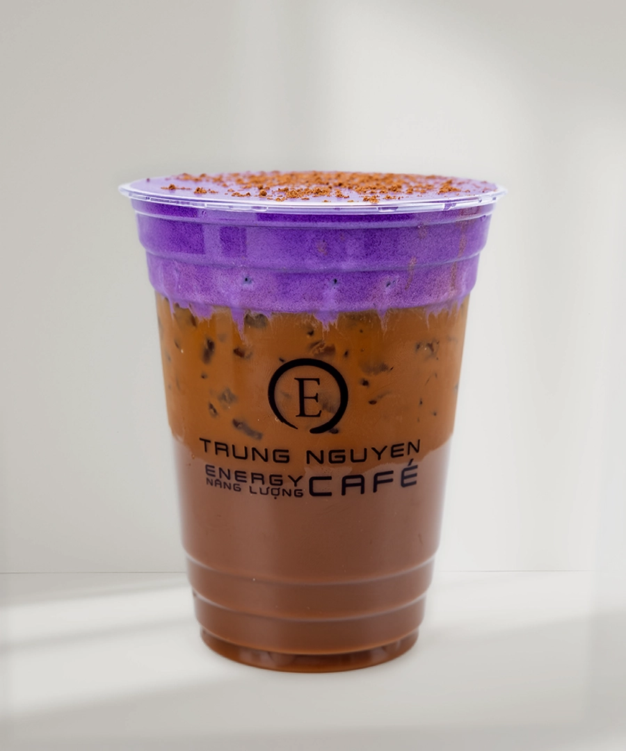Trung Nguyên E-Coffee specialty drink featuring a layered purple foam and coffee, served