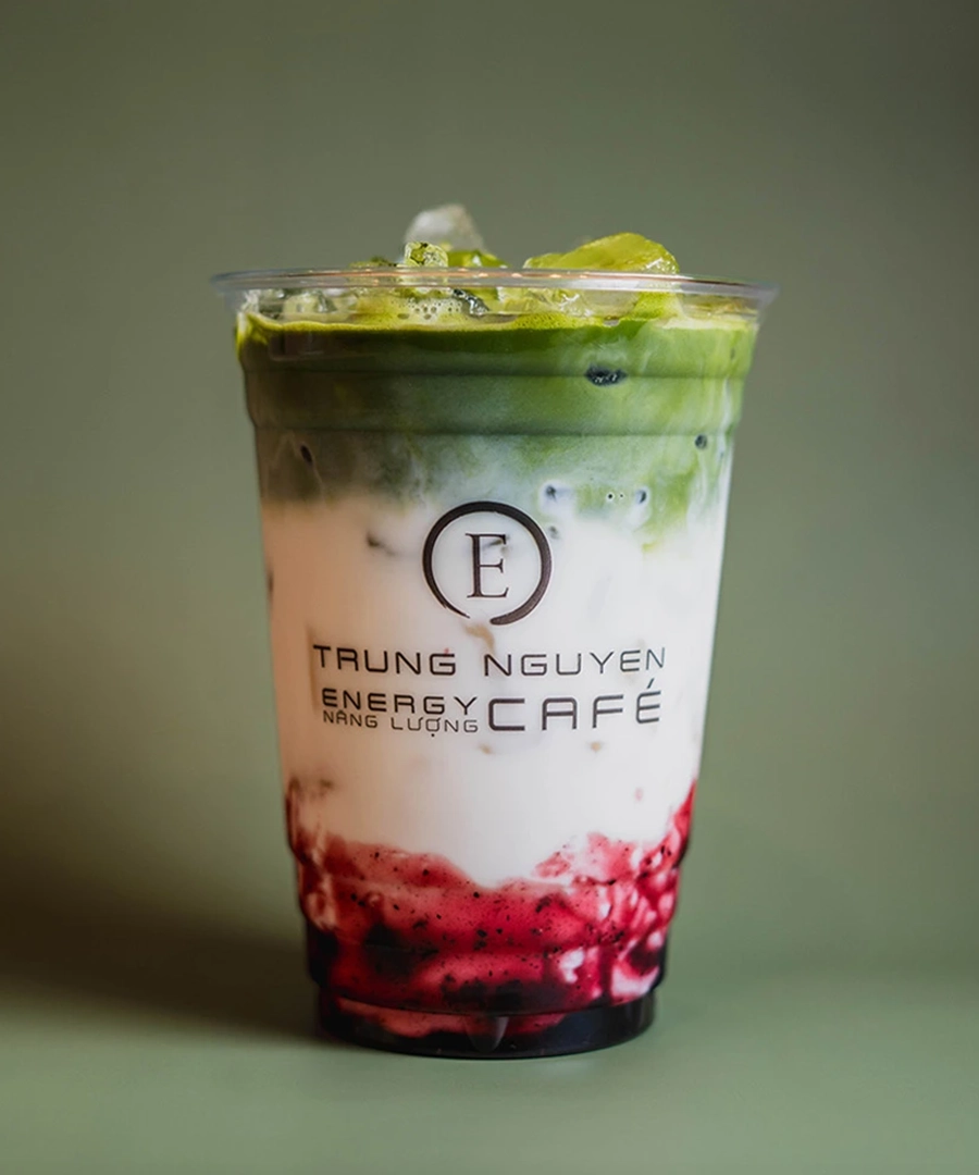 A refreshing iced matcha latte from Trung Nguyên E-Coffee, showcasing the signature layered drink